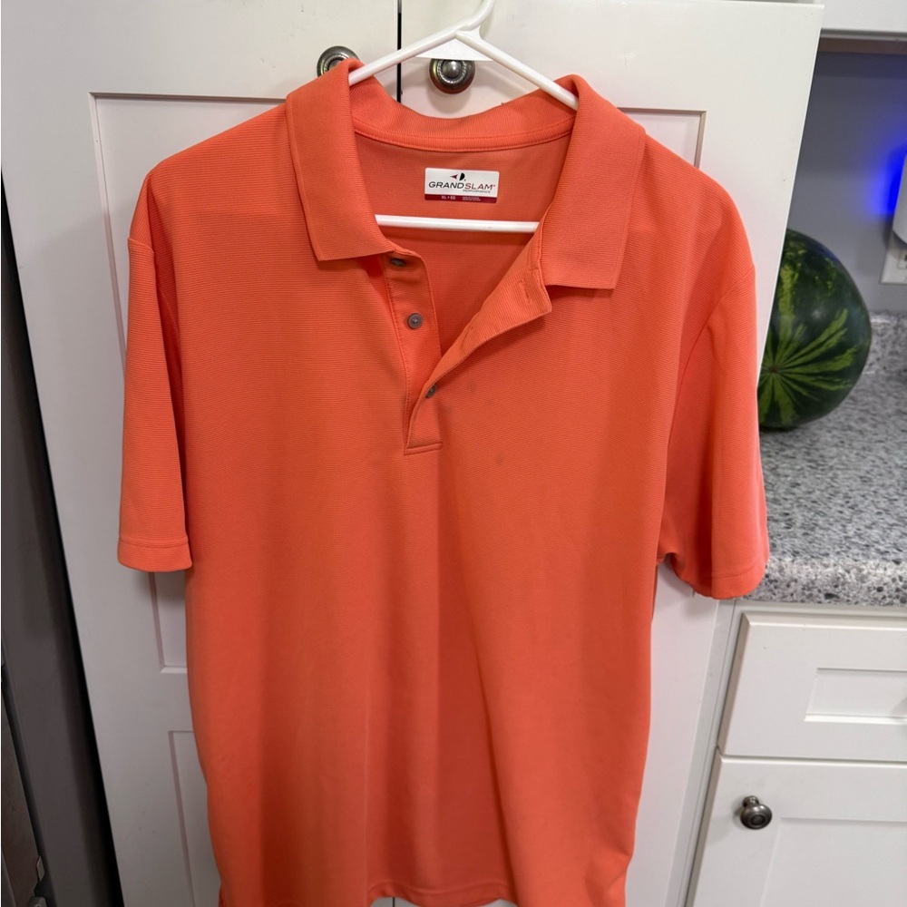 Grand Slam Men's Polo in Vibrant Coral
